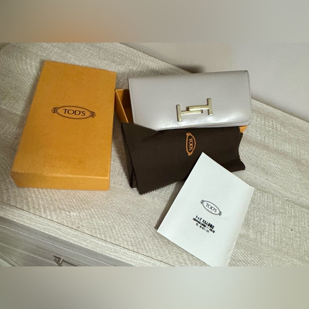 Tod's White Leather Clutch with Gold Accent